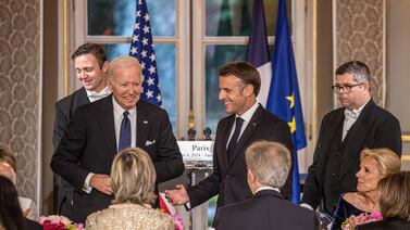 French President Emmanuel Macron with US President Joe Biden at the state dinner. Reuters