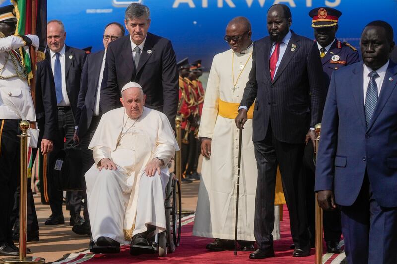 Pope Francis is welcomed by President Salva Kiir, second from right, on arrival at Juba airport, South Sudan. AP Photo