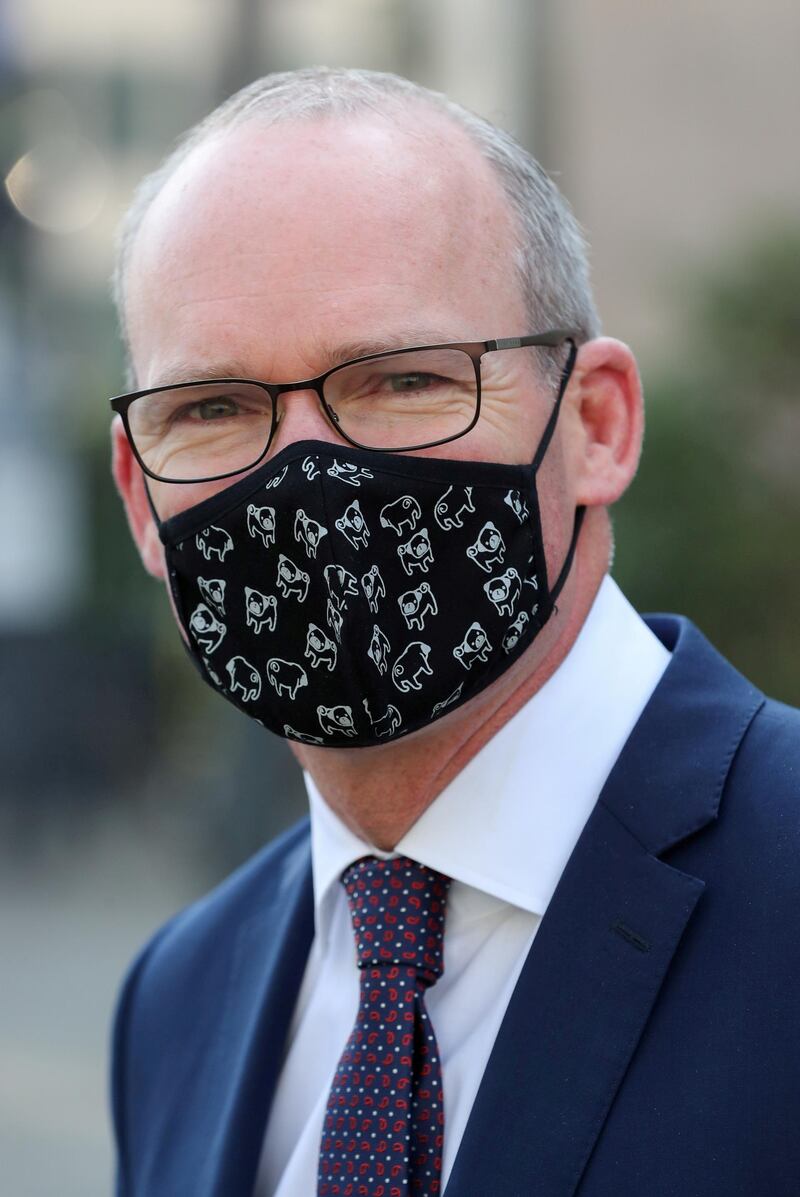 FILE PHOTO: Irish Foreign Minister Simon Coveney wearing a face mask, is seen after a European general affairs ministers council, in Brussels, Belgium September 22, 2020. REUTERS/Yves Herman/File Photo