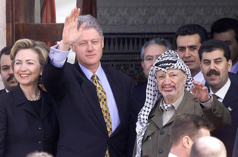 December 14, 1998: Then-US president Bill Clinton, second from left, who was accompanied by his wife Hillary, left, and Palestinian President Yasser Arafat, wave to the crowds upon the Clintons’ arrival at the Gaza international airport in Rafah. Clinton made history when he flew into Gaza airport on a highly symbolic first visit ever by a US leader to the Palestinian territories. AFP Photo