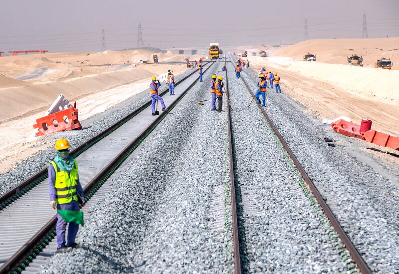 Railroad track workers along the Saih Shuaib line.