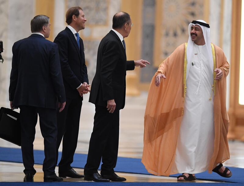 Russian Foreign Minister Sergei Lavrov (2nd R) speaks to his Emirati counterpart, Sheikh Abdullah bin Zayed al-Nahyan (R), during a visit by Russia's president to the United Arab Emirates at Abu Dhabi's Al-Watan presidential palace on October 15, 2019.  Russian President Vladimir Putin is on an official visit to the UAE after Saudi Arabia, seeking to attract over $1.3 billion worth of investments in Russia's economy. / AFP / KARIM SAHIB
