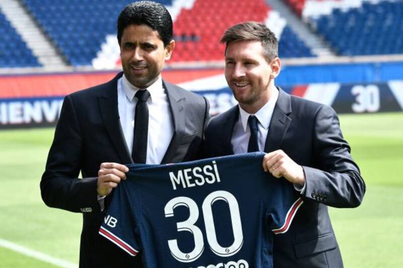 Paris Saint-Germain president Nasser Al-Khelaifi poses alongside Argentina star player Lionel Messi.