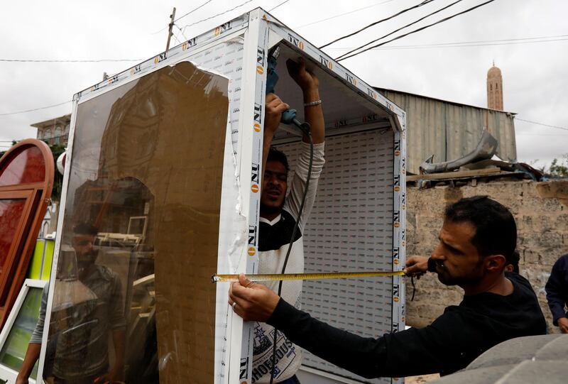 Yemenis make a disinfection chamber amid concerns over the spread of the coronavirus COVID-19, at a workshop in Sanaa, Yemen.  EPA