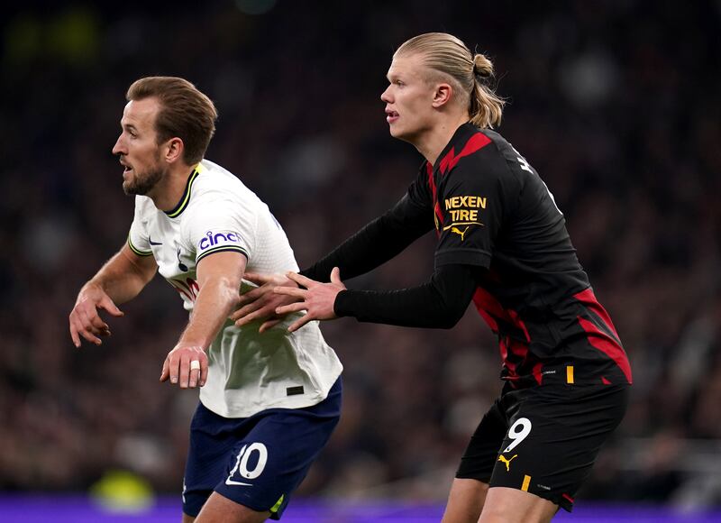 Tottenham Hotspur's Harry Kane, left, and Manchester City's Erling Haaland in action. PA