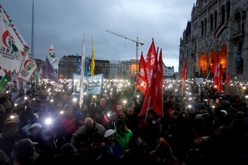 Demonstrators protesting against recent legislative measures introduced by the government of Hungarian Prime Minister Viktor Orban stand outside Parliament  in Budapest, Hungary. Getty