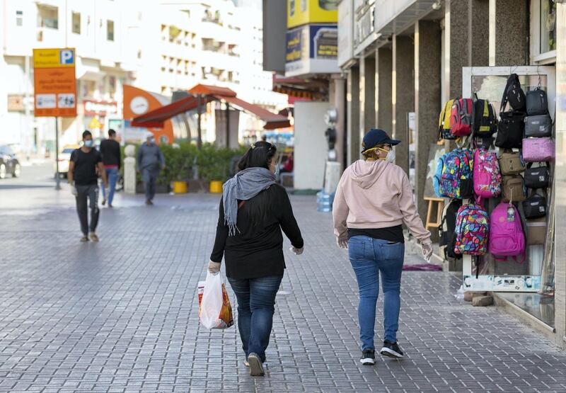 Dubai, United Arab Emirates - Reporter: N/A: Coronavirus / Covid-19. Two ladies go shopping in Al Hudaiba Road, Satwa after the lifting of the 24hr lockdown. Saturday, April 25th, 2020. Dubai. Chris Whiteoak / The National
