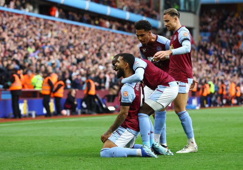Aston Villa's Douglas Luiz celebrates scoring their first goal with Moussa Diaby, Matty Cash and Boubacar Kamara. Action Images 
