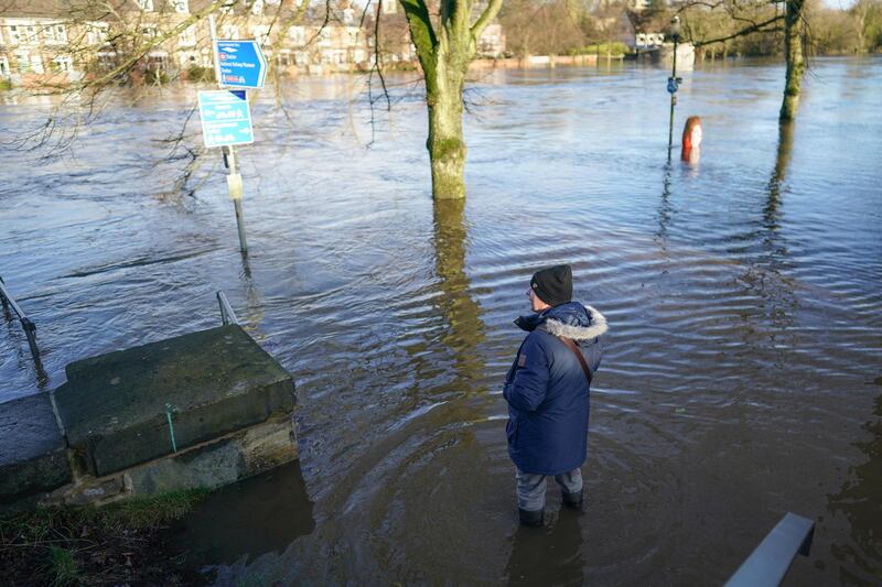 A man stands and looks out over the River Ouse in York. Getty Images