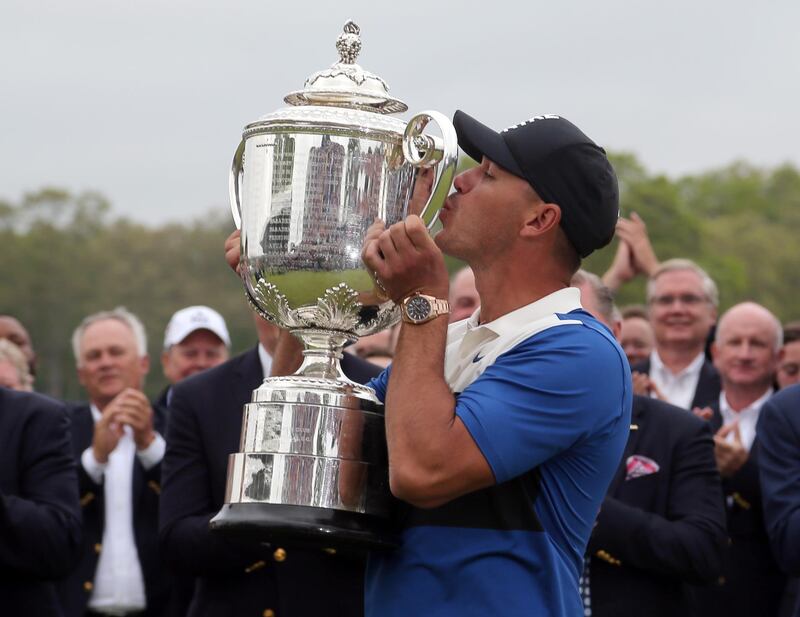 Brooks Koepka celebrates with the Wanamaker Trophy. USA Today