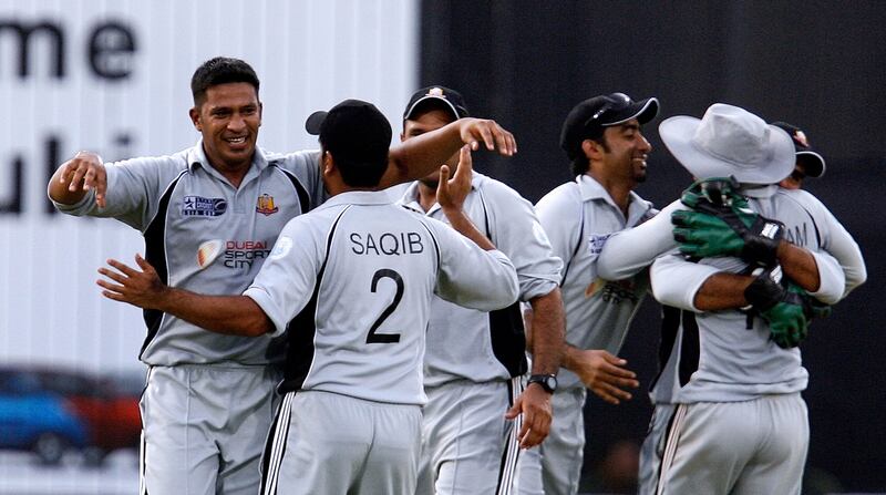 United Arab Emirates' cricketer Fahad Al Hashmi (L) celebrates the wicket of Sri Lanka cricketer Tilakratne Dilshan with teammates during a Group A match between Sri Lanka and the UAE for the Asia Cup at Gaddafi Stadium in Lahore on June 26, 2008.  Sri Lanka scored 203 runs for the loss of 6 wickets in 32 overs after winning the toss and electing to bat first.           AFP PHOTO/ Prakash SINGH / AFP PHOTO / PRAKASH SINGH