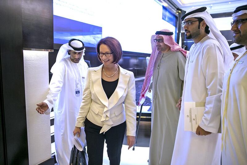 Julia Gillard, former prime minister of Commonwealth of Australia, walks with guests after she delivered her lecture The UAE and Australia: a Roadmap for Future Cooperation yesterday. Silvia Razgova / The National