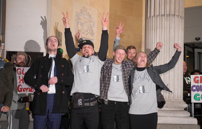 Sage Willoughby, Jake Skuse, Milo Ponsford and Rhian Graham celebrate after receiving a not guilty verdict at Bristol Crown Court on Wednesday. The four protesters were found not-guilty of criminal damage after the statue of 17th-century slave trader Edward Colston was pulled down and thrown into Bristol Harbour on June 7, 2020. Getty Images
