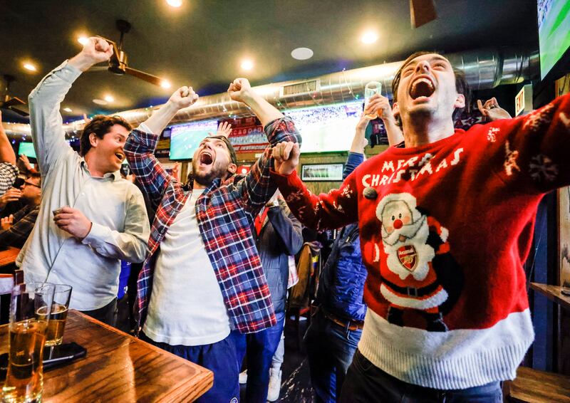 Football fans celebrate as the USA score in the first half against Iran at The Globe Pub in Chicago, Illinois. EPA