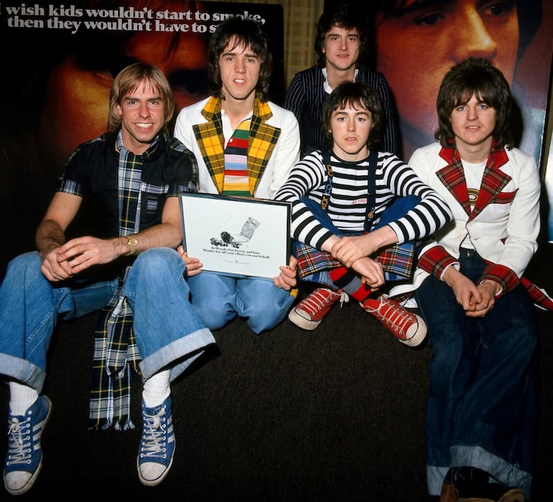 FILE PHOTO: FILE PHOTO DATED 1975 - Derek Longmuir, Alan Longmuir, Les McKeown (back), Ian Mitchell and Stewart Wood during an anti-smoking campaign launch in 1975./File Photo