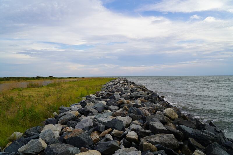 A rock-filled breakwater wall was installed on the island's western edge in 1989. Residents say it has successfully stopped erosion on that side of the island. 