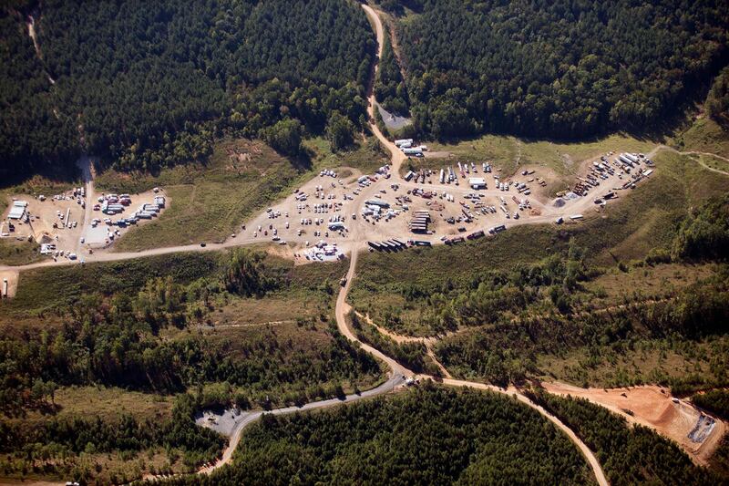 Vehicles are seen near Colonial Pipeline in Helena, Alabama. Colonial Pipeline said in a statement late Friday that it “took certain systems offline to contain the threat, which has temporarily halted all pipeline operations, and affected some of our IT systems.” AP Photo