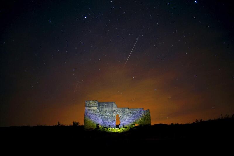 Meteors streak across the sky over a Roman theatre in the ruins of Acinipio near Ronda, southern Spain. Jon Nazca / Reuters