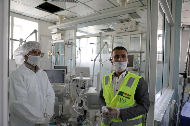 A nurse and a trainer during a lesson on how to operate ventilators recently provided by the World Health Organisation, in an intensive care ward for coronavirus patients in Sanaa. Reuters, file