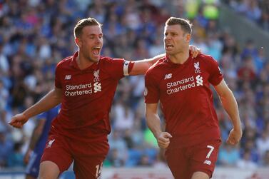 James Milner, right, scored from the penalty spot against Cardiff City to return Liverpool to the top of the Premier League table. Reuters