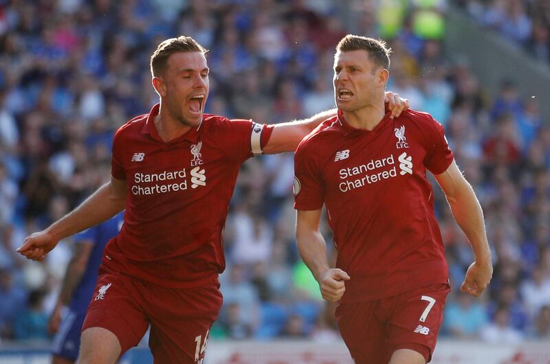Soccer Football - Premier League - Cardiff City v Liverpool - Cardiff City Stadium, Cardiff, Britain - April 21, 2019   Liverpool's James Milner celebrates scoring their second goal with Jordan Henderson    Action Images via Reuters/Carl Recine    EDITORIAL USE ONLY. No use with unauthorized audio, video, data, fixture lists, club/league logos or "live" services. Online in-match use limited to 75 images, no video emulation. No use in betting, games or single club/league/player publications.  Please contact your account representative for further details.