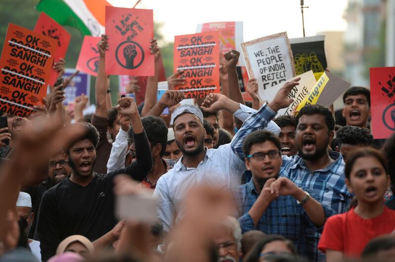 Students and demonstrators hold placards and shout slogans during a protest against India's new citizenship law in Chennai on December 19, 2019. Indians defied bans on assembly on December 19 in cities nationwide as anger swells against a citizenship law seen as discriminatory against Muslims, following days of protests, clashes and riots that have left six dead. AFP