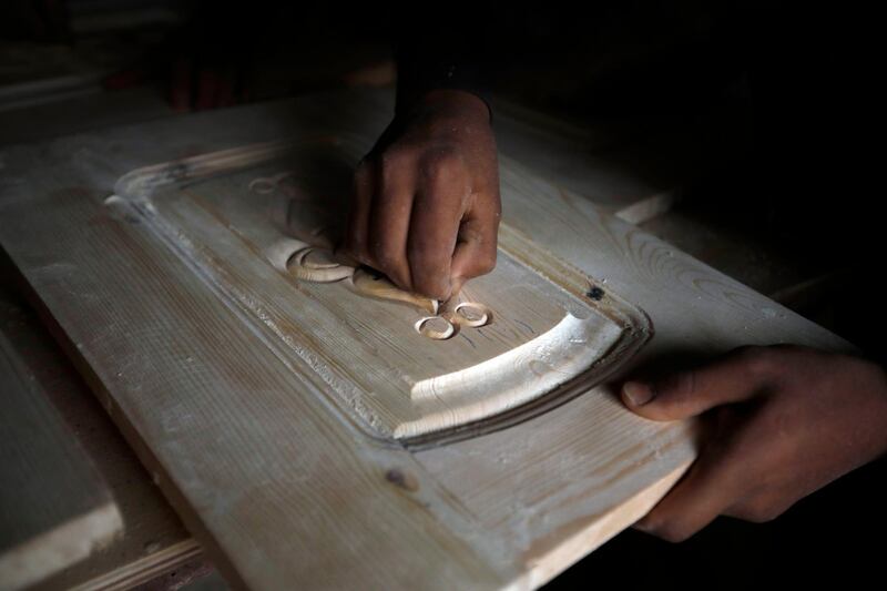 A Yemeni labourer works at a wood shop on International Labour Day in the country's capital, Sanaa. International Labour Day, or May Day, is observed annually on 1 May around the world and celebrates workers, their rights, achievements and contributions to society. EPA