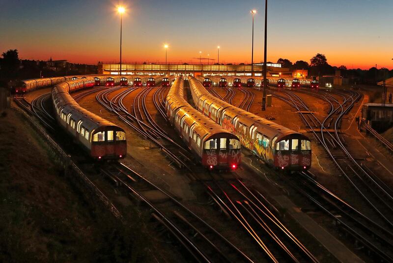 Piccadilly Line underground trains are parked at a depot at Boston Manor station in London, UK, at sunrise.Frank Augstein/AP Photo