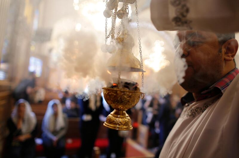 A priest spreads incense during funeral service for the slain Christians at Church of Great Martyr Prince Tadros. AP Photo