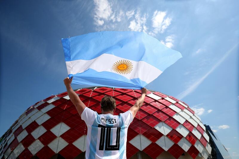 An Argentina fan poses outside the stadium prior to the game. Clive Rose / Getty Images