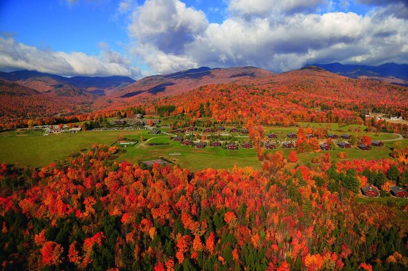 Aerial view of fall foliage including Trapp Family Lodge in Stowe, Vermont. The wiener schnitzel with lingonberry jam and apple strudel are must-haves when staying at the lodge. Don Landwehrle / iStockphoto.com