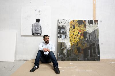 DUBAI , UNITED ARAB EMIRATES Ð Feb 20 : Tammam Azzam , Syrian artist with his work at the Ayyam Gallery in Alserkal Avenue in Dubai. ( Pawan Singh / The National ) For Review. Story by Tahira