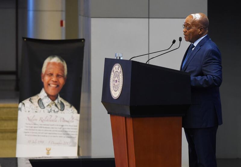 South African President Jacob Zuma makes a speech near a portrait of late South African president Nelson Mandela, on the anniversary of Mandela’s death, at Tsinghua University in Beijing. Greg Baker / AFP Photo