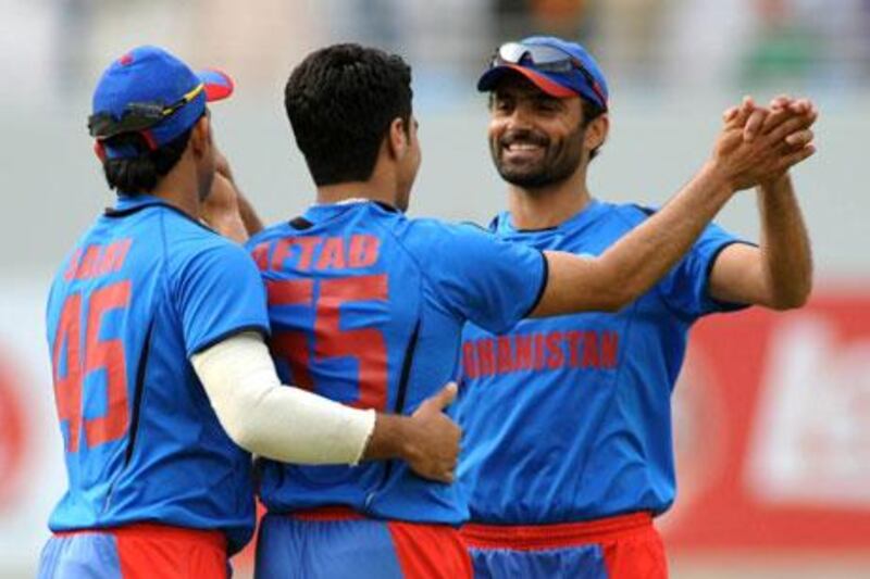Afghanistan 47-run win over Namibia booked their spot in the ICC World Twenty20 tournament at Sri Lanka in September.
