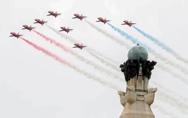 Members of Britain's Red Arrows, the flying display team of the Royal Air Force (RAF) during an event to commemorate the 75th anniversary of the D-Day landings, in Portsmouth, southern England.  AFP