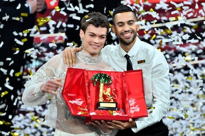 Mahmood and Blanco hold the trophy after winning the 72nd Sanremo Music Festival in Italy on February 5, 2022. LaPresse via AP