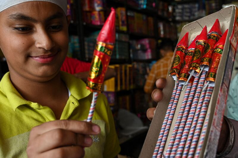 People buy firecrackers on the eve of the Hindu festival of Diwali, in Amritsar. AFP