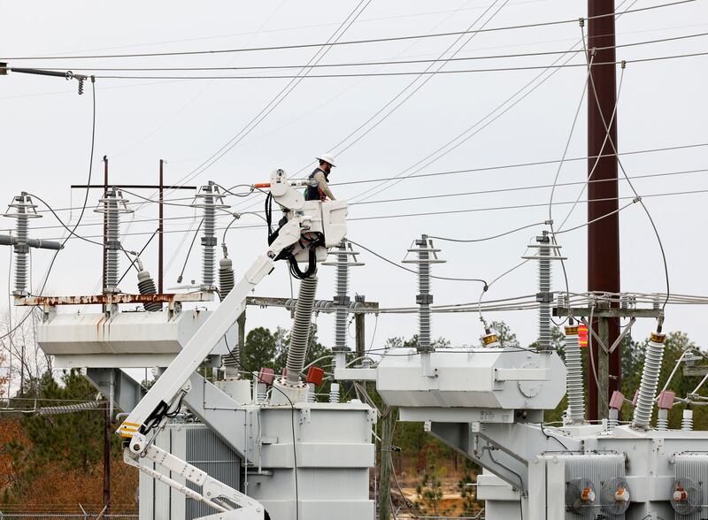 Duke Energy personnel work to restore power at a second electrical substation after an act of vandalism. Reuters