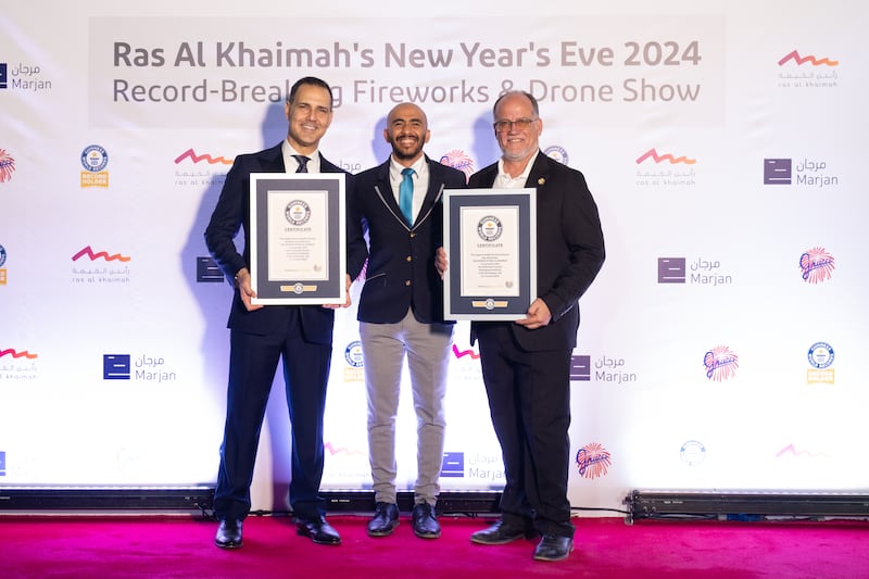 From left: Raki Phillips, chief executive of Ras Al Khaimah Tourism Development Authority; Raafat Tawfik, Guinness World Records official adjudicator; and Phil Grucci of Grucci fireworks, the company behind the pyrotechnics