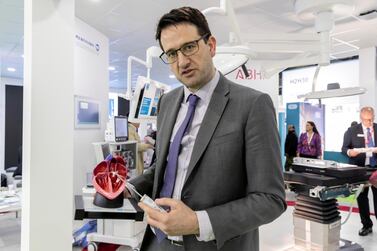 Dr Robert Smith, a consultant cardiologist explains how an aortic valve can be fixed without needing open-heart surgery. Antonie Robertson / The National