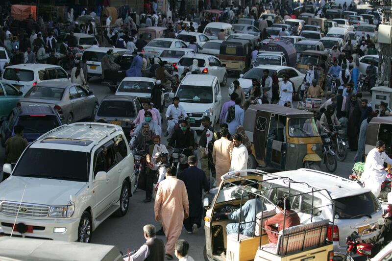 People rush to shop for the Eid holiday that marks the end of the Muslim holy fasting month of Ramadan after the government relaxed a weeks-long lockdown that was enforced to help curb the spread of the coronavirus, in Quetta, Pakistan. AP Photo