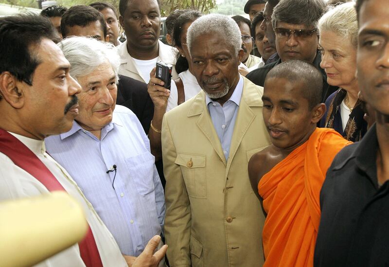 Former UN secretary general Kofi Annan, centre, former Sri Lankan prime minister Gotabaya Rajapkse, left, and Wolfensohn visit a destroyed Buddhist temple in Hambantota on  January 8, 2005. Reuters