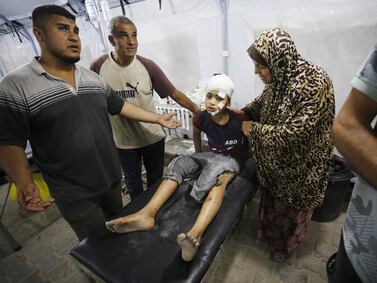 GAZA CITY, GAZA - MAY 10: Injured Palestinians, including children are brought to Al-Awda Hospital after an Israeli attack on al-Nuseirat refugee camp in Gaza City, Gaza on May 10, 2024. (Photo by Ashraf Amra/Anadolu via Getty Images)
