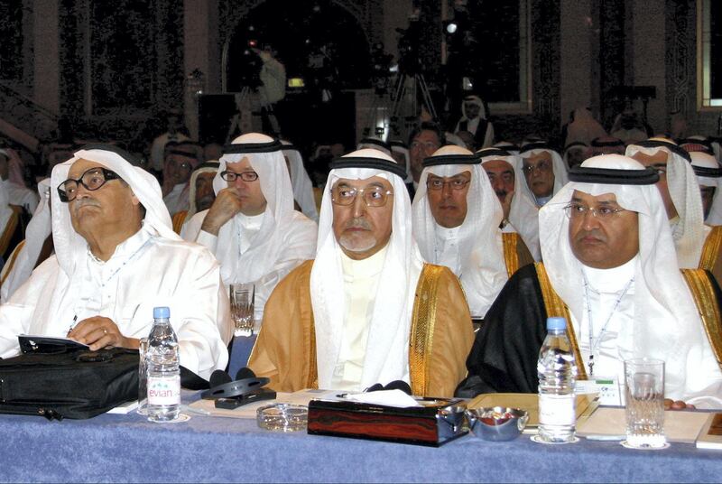 Saudi chairman of the Dallah company Saleh Kamel (L), Minister of Trade and Economy Dr Hashem Yamani (R) and Saudi busnissman Osama Jaafar Faqih (C)  part in the Jeddah Economic Forum 17 January 2004. So long marginalised in Saudi Arabia, women dominated today's opening of the influential Jeddah Economic Forum, which heard a ringing call for change from the first female to deliver the keynote speech. Lubna al-Olayan, chief executive officer of Olayan Financing and one of the conservative kingdom's top businesswomen, sent out an unveiled and hard-hitting message in her address entitled "A Saudi Vision for Growth". AFP PHOTO/Mahmoud Mahmoud (Photo by MAHMOUD MAHMOUD / AFP)