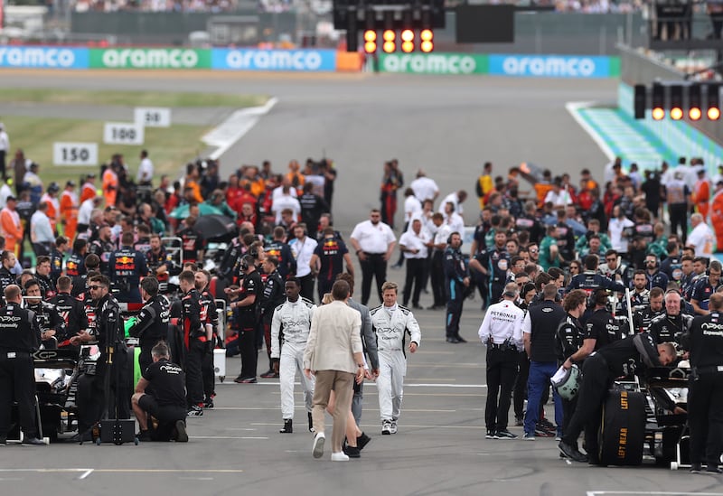 Pitt and Idris on the grid during the F1 Grand Prix. Getty Images