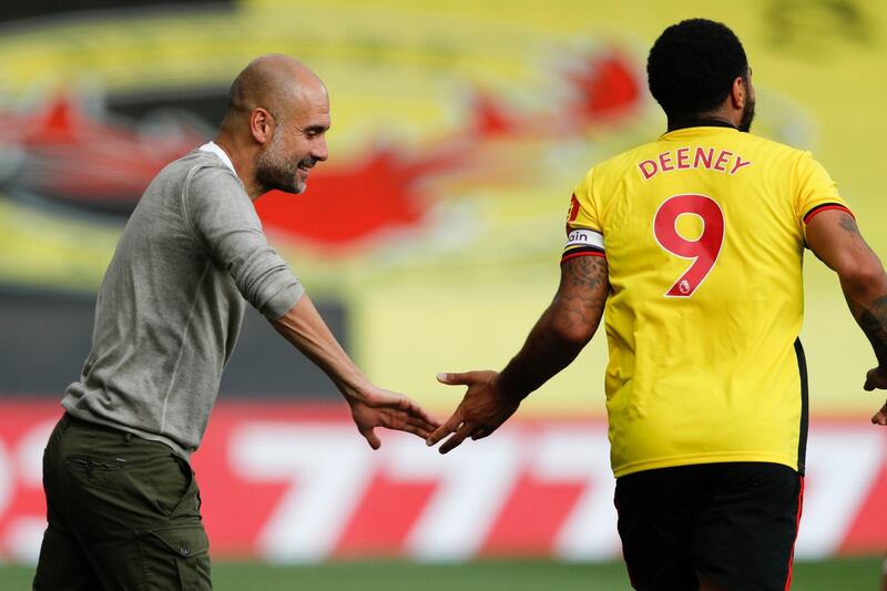 roy Deeney of Watford and City manager Pep Guardiola. EPA
