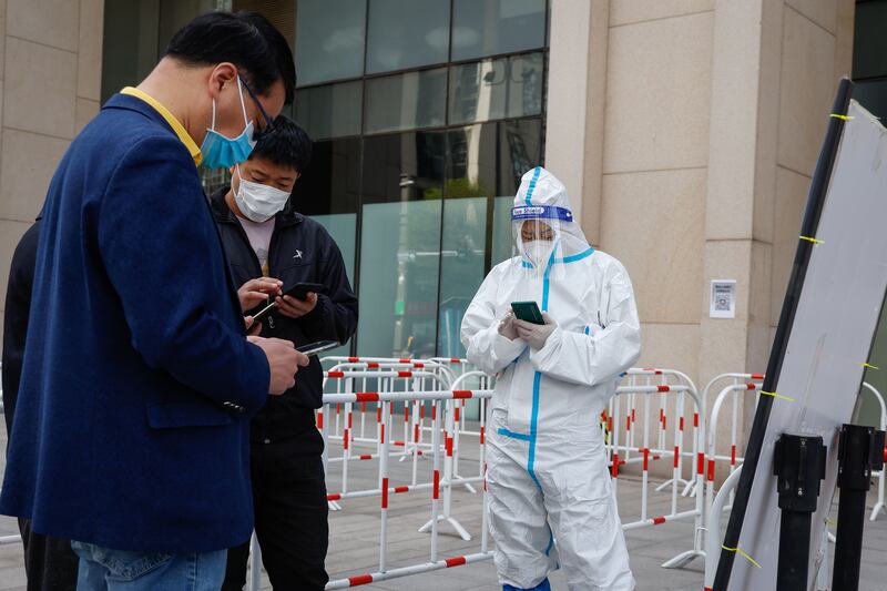 Shanghai reported 25,141 new asymptomatic coronavirus cases on April 12, 2022, up from 22,348 a day earlier. EPA