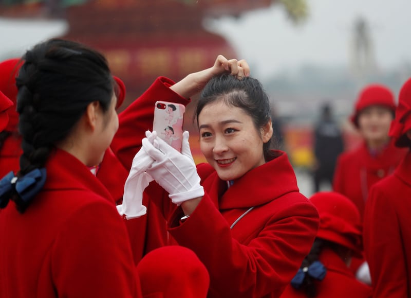 "Hailing the start of a "new era," Mr Xi outlined a vision in which the party would lead China on the road to becoming a "great modern socialist country" by 2050. Ahmad Masood / Reuters