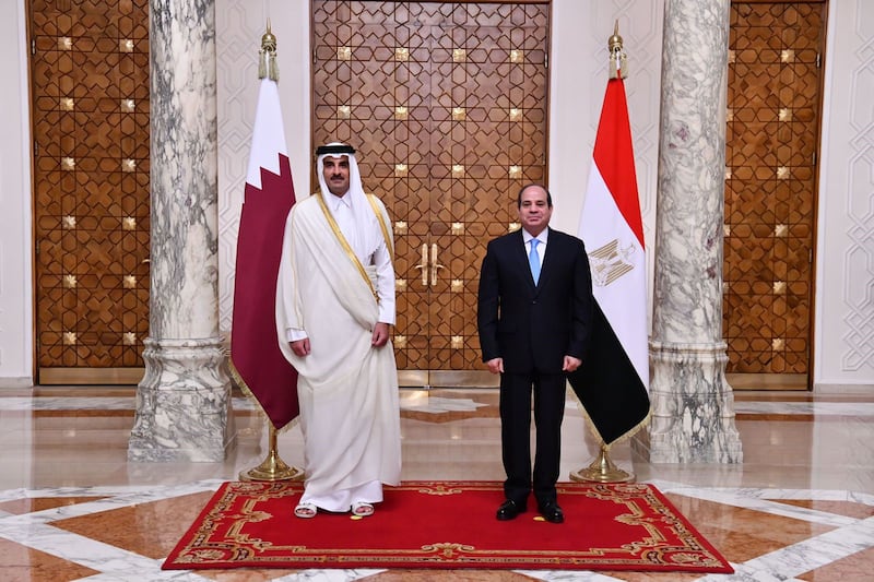 Sheikh Tamim, left, pictured with Mr El Sisi, last visited Egypt in 2015. Egyptian Presidency