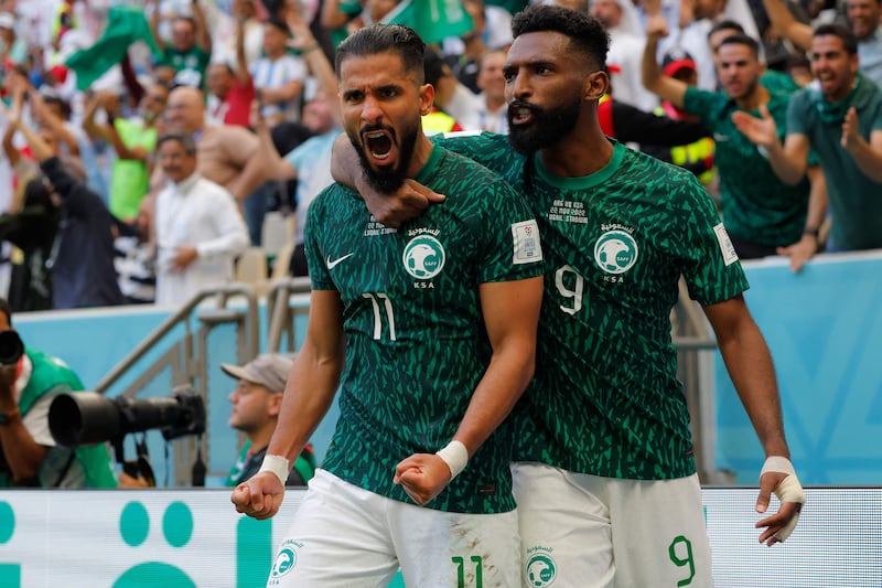 Saudi Arabia's Saleh Al Shehri, left, celebrates after scoring the equaliser against Argentina. AFP